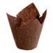 A Baker's Mark chocolate brown tulip baking cup with a brown paper wrapper on a white background.