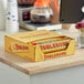A case of Toblerone chocolate bars on a counter.