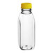 A clear plastic Square Milkman juice bottle with a yellow lid.