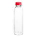 A clear bottle with a red cap.