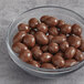 A bowl of Albanese Milk Chocolate Covered Peanuts.