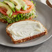 A sandwich on a plate with a close up of Only Plant Based! Vegan Mayonnaise on it.