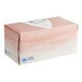A pink and white Puffs box of tissue paper.