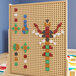 A Flash Furniture multi-color peg board with colorful pieces on it.