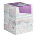 A stack of Puffs Ultra Soft 2-ply facial tissue boxes with a floral pattern.