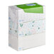 A stack of three Puffs Plus Lotion facial tissue boxes.