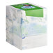 A stack of Puffs Plus Lotion facial tissue boxes in plastic wrap.