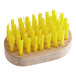 A Fox Run wooden brush with yellow bristles.