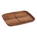 An Ironwood Gourmet acacia serving board with two compartments on a table in a home kitchen.