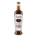 A bottle of Amoretti Chocolate Craft Puree with chocolate syrup inside.