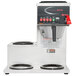 A Grindmaster automatic coffee brewer with three warmers.