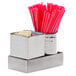 An American Metalcraft stainless steel round sugar packet holder on a counter with straws in it.