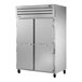 A True Manufacturing white reach-in freezer with two solid doors.