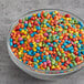 A bowl of Rainbow Sugar Shell Cocoa Drops.