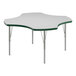 A white table with a green edge and silver legs.
