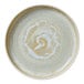 A white Heart & Soul porcelain plate with raised spiral designs on the rim.