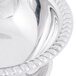 A close-up of a stainless steel Vollrath sherbet dish with a handle.