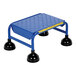 A blue Vestil commercial rolling step ladder with black rubber feet.