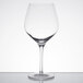 A close-up of a clear Stolzle Exquisit Burgundy wine glass.