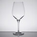 A Stolzle Exquisit Bordeaux wine glass on a table.