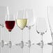 A group of Stolzle Chardonnay wine glasses on a white background.