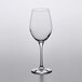 A clear Stolzle Chardonnay wine glass on a white surface.