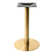 A gold stainless steel table base with a black bottom.