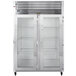 A Traulsen reach-in refrigerator with two glass doors on a stainless steel cabinet.