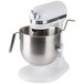 A white KitchenAid bowl lift countertop mixer with a stainless steel bowl.