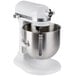 A white KitchenAid stand mixer with a stainless steel mixing bowl.