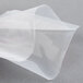 A person holding an ARY VacMaster clear plastic vacuum packaging bag.
