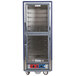 A blue Metro C5 heated holding and proofing cabinet with clear Dutch doors.