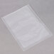A clear plastic bag on a gray surface.