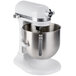 A white KitchenAid stand mixer with a stainless steel bowl attached.