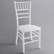 A white Lancaster Table & Seating Chiavari chair with a white seat and back.