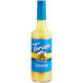 A Torani 750 mL glass bottle of sugar-free lemon syrup.