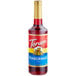 A Torani Pomegranate syrup 750 mL glass bottle with a label.