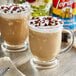 A glass mug of coffee with Torani Chocolate Macadamia Nut flavoring on top.
