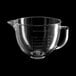 A clear glass KitchenAid mixing bowl with a handle.