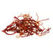 A pile of Shank's Spanish Saffron threads with orange and yellow colors.