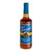A Torani Sugar-Free Brown Sugar Cinnamon flavoring syrup bottle with a blue label.