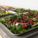 A Vollrath stainless steel food pan full of salad with berries, nuts, and fruit.