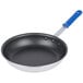 A black Vollrath Wear-Ever non-stick fry pan with a blue handle.