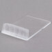 A clear plastic container with a clear lid holding white cards with chalk writing on them.