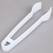 White plastic tongs with a handle.