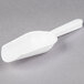 A white plastic Fineline ice scoop with a handle.