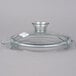A clear glass lid with a handle for a Robot Coupe commercial food processor.