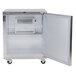 A silver Traulsen undercounter refrigerator with a door open.
