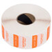 A roll of white paper with orange and white labels with the word "Saturday" and a black and tan circle.