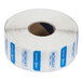 A roll of white labels with blue writing and a blue stripe with the Noble Products logo.